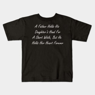 A father holds his daughter’s hand for a short while, but he holds her heart forever Kids T-Shirt